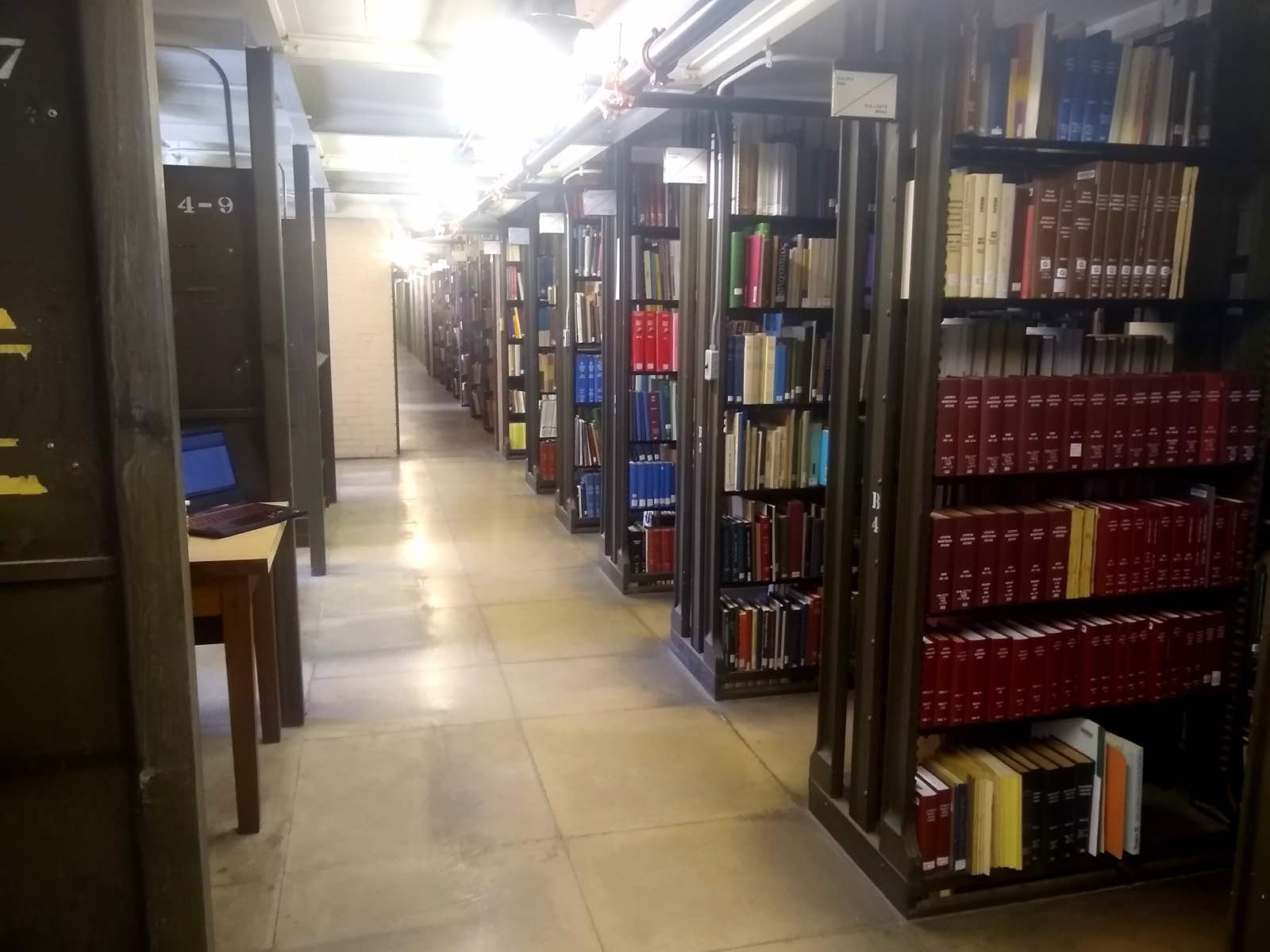 Rows of library shelves full of books